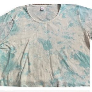 A tie dye crop top and not as big at it seems but it’s very cute and worn once